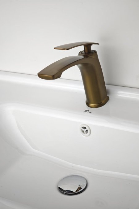 حنفية مغسلة ذهبي معتّق بتصميم انسيابي عصري